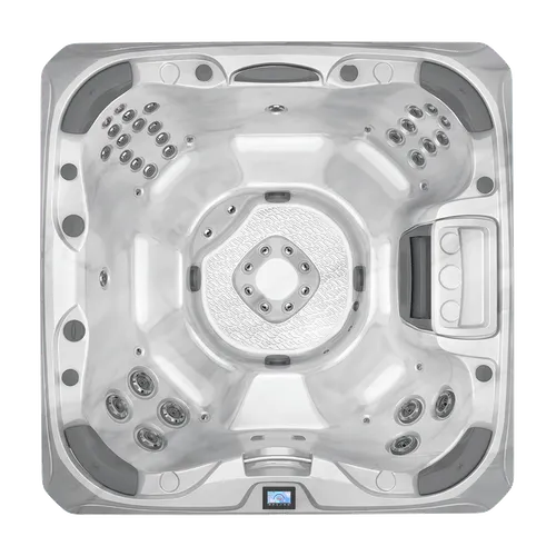 Top view of a compact hot tub with multiple jets.